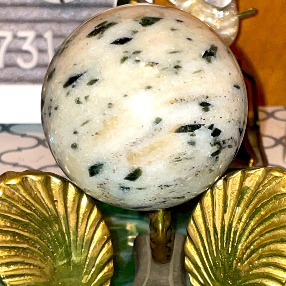 Green tourmaline in quartz sphere
